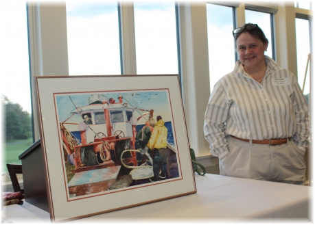 Watercolor artist Kate Somers with her painting 